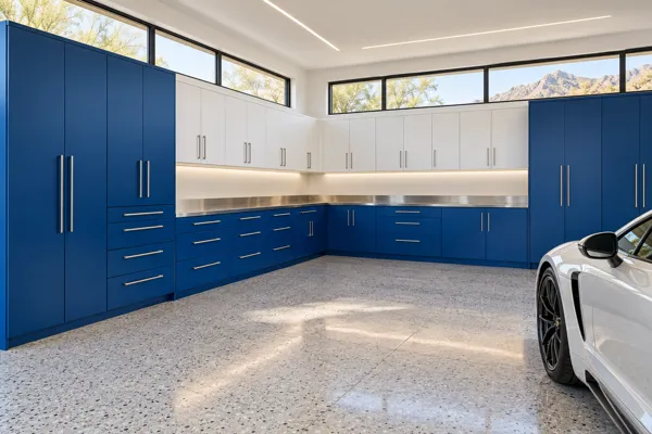 Cobalt Collection garage concept with cobalt blue, white & brushed metal cabinetry and l-shaped cabinet wall.
